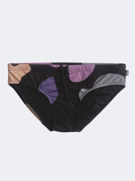 Black swim brief with colorful abstract pattern on a white background